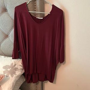 Nice top with dolman sleeves - burgundy color, v-neck style.